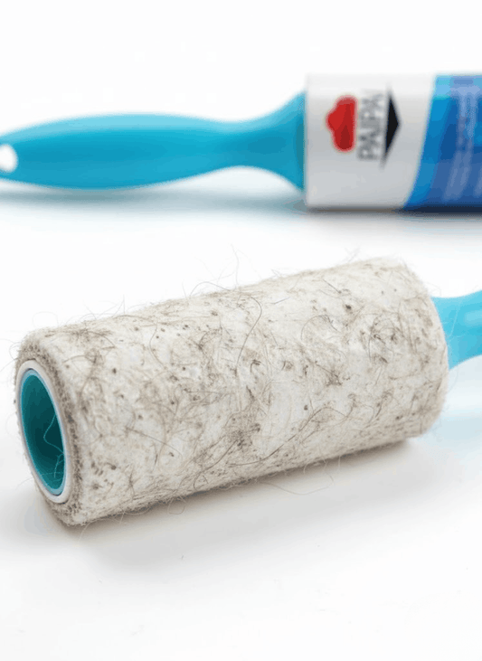 Roller with a textured surface and blue handle on a white background