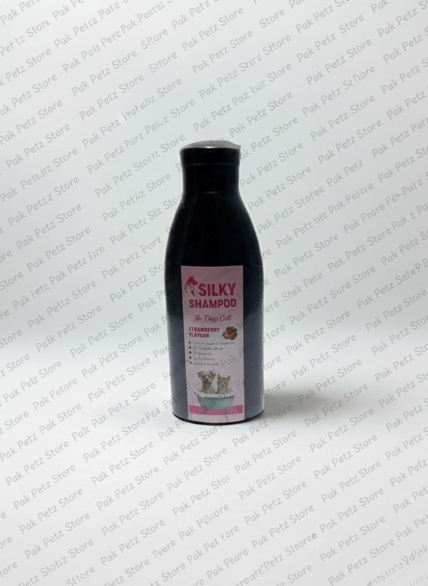 Black bottle of Silky Shampoo on a white background