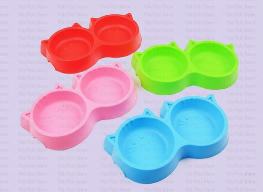 Four colorful silicone snack holders on a light purple background
